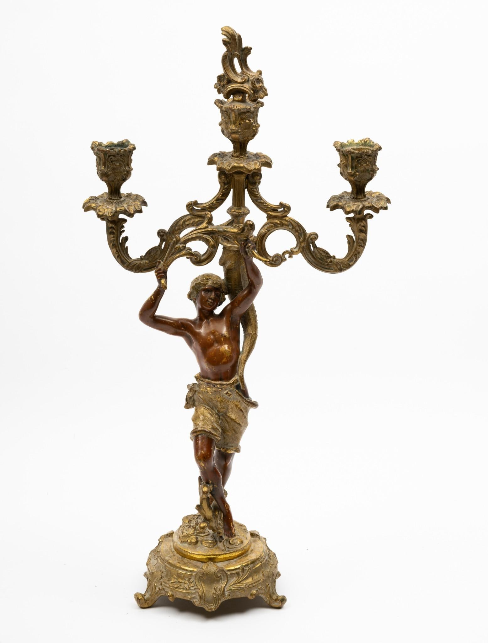 Brass Figural Candelabra: 5" wide x 15" high. Minimal wear consistent with age and use.
