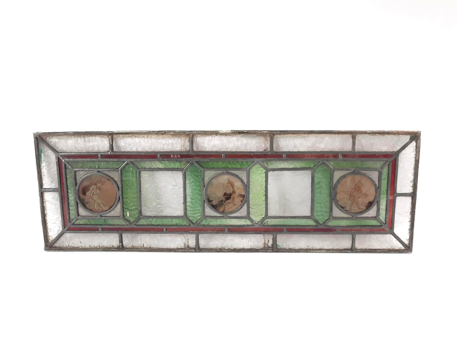 Stained Glass Window Panel: NOT ELIGIBLE FOR IN-HOUSE SHIPPING. Overall with frame: 10" high x 30-1/4" wide. Some paint markings around edging.