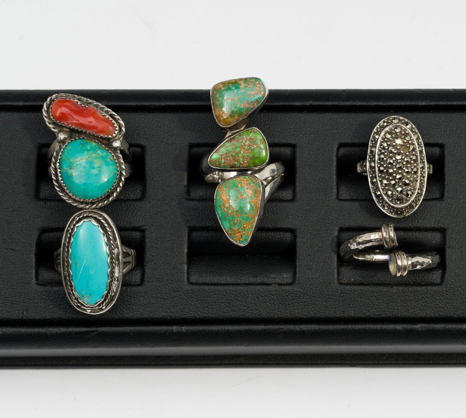 5 Sterling Silver Rings: Includes turquoise, coral, marcasite, and one marked 950 missing end stones. Sizes 6 to 9. Total weight 1.4 troy ounces.