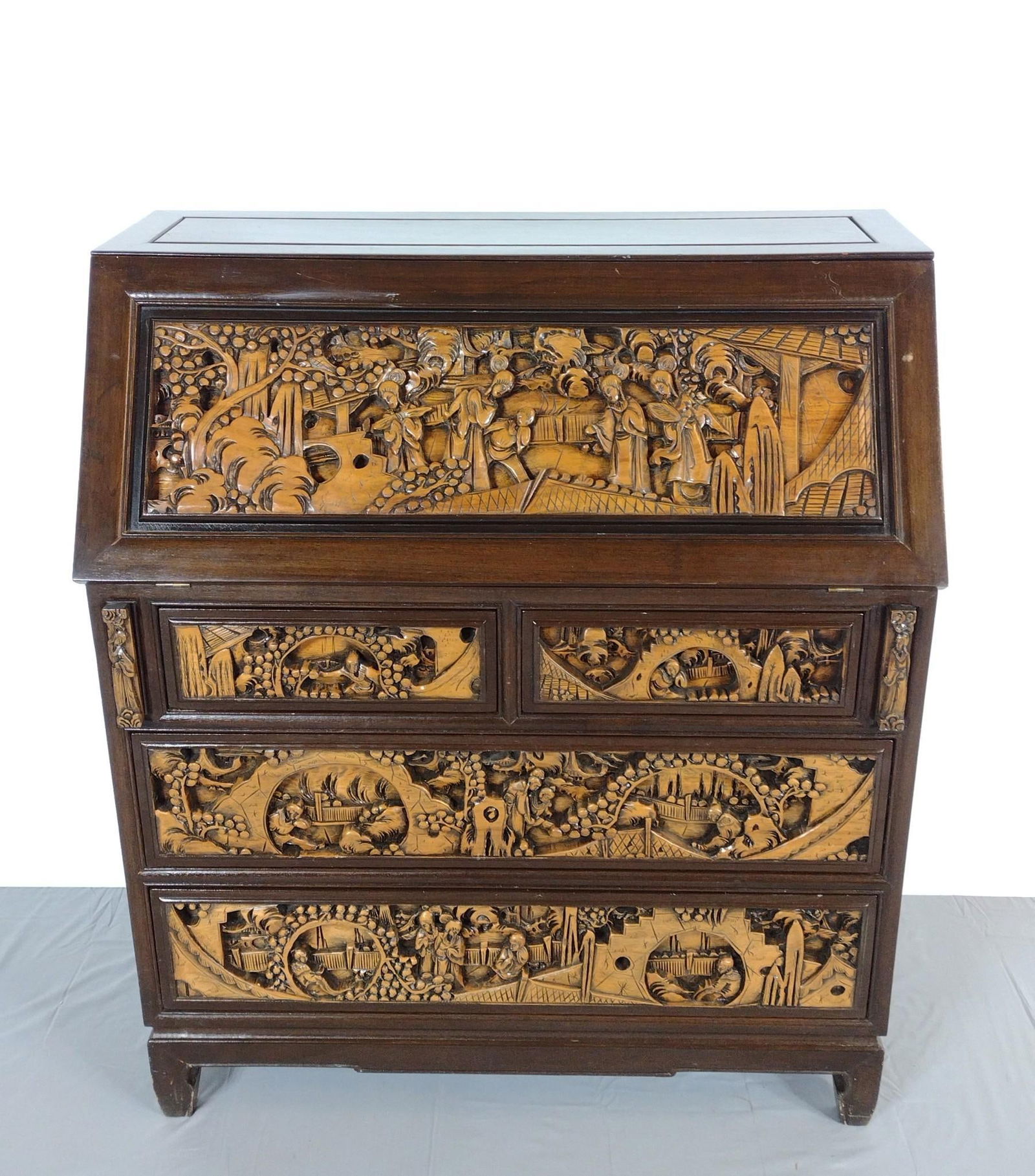 Asian Carved Slant Front Desk: NOT ELIGIBLE FOR IN-HOUSE SHIPPING. 36" wide X 18" deep X 42" high. Has a few light scratches. No manufactures name found.