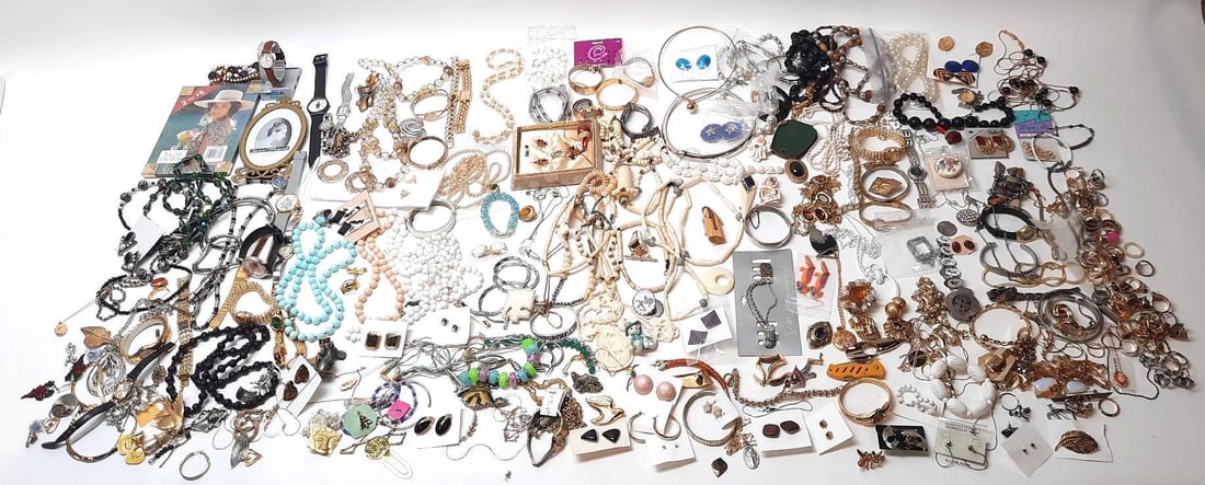 Large Grouping of Costume Jewelry: Includes necklaces, bangles and more. Sold as is.