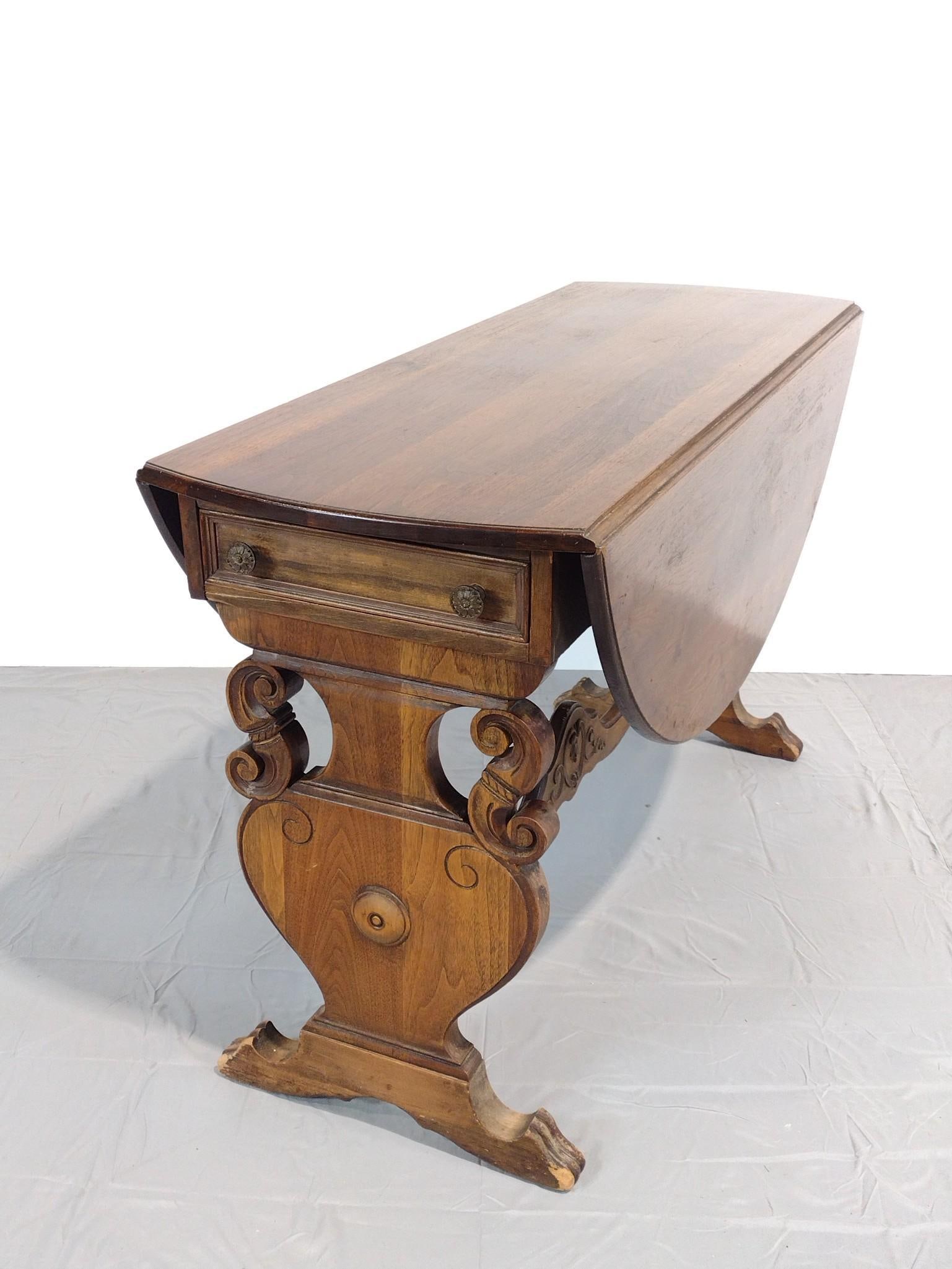 Drop Leaf Table: NOT ELIGIBLE FOR IN-HOUSE SHIPPING. Open 47-1/2", closed 18-1/2" wide X 47-1/2" deep X 29" high. Has some light scratches. Also has areas of finish loss.