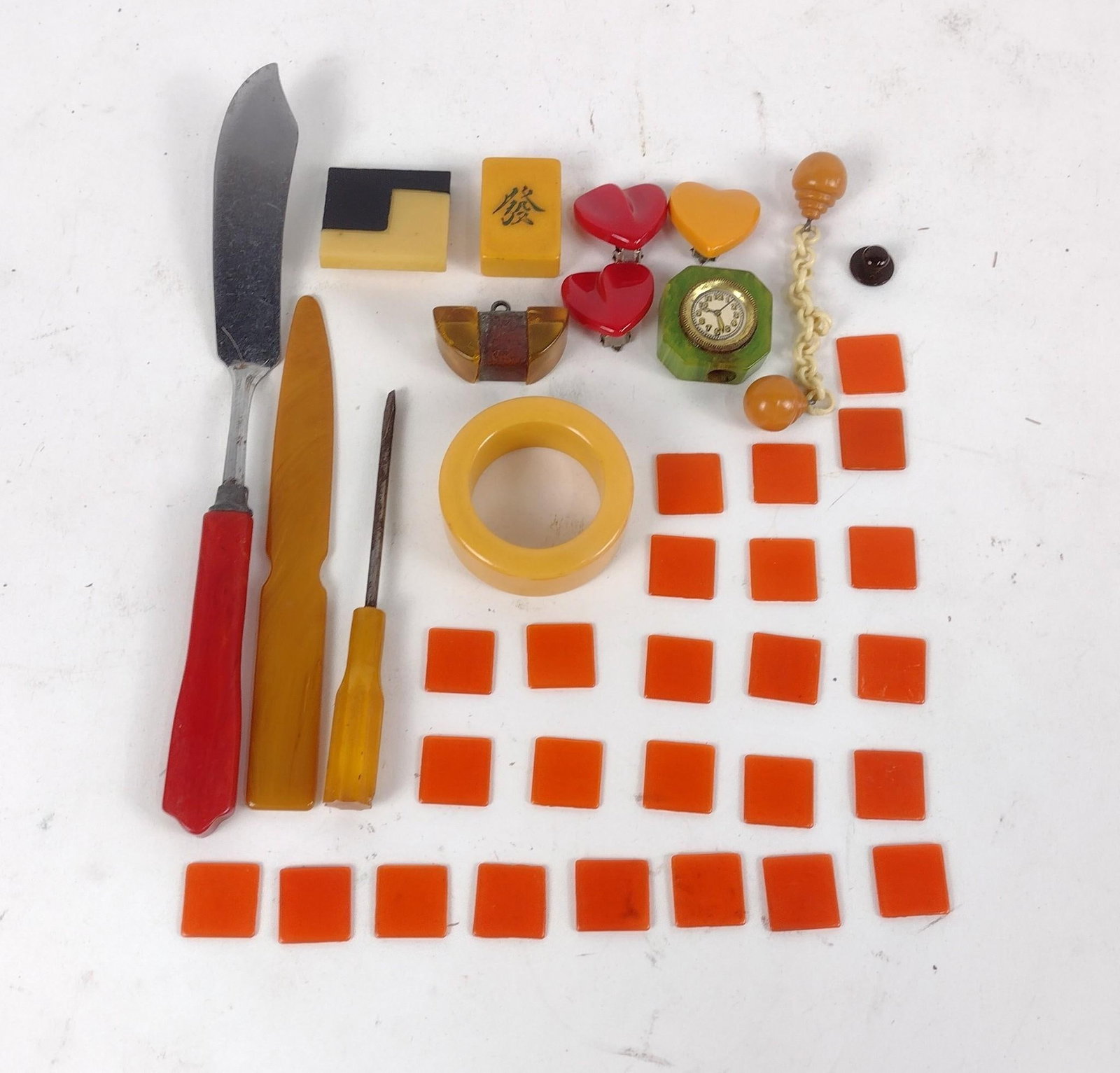 37 Pcs Bakelite Articles: Includes pencil sharpener, letter opener, and game pieces. 1/2" to 8-1/4".