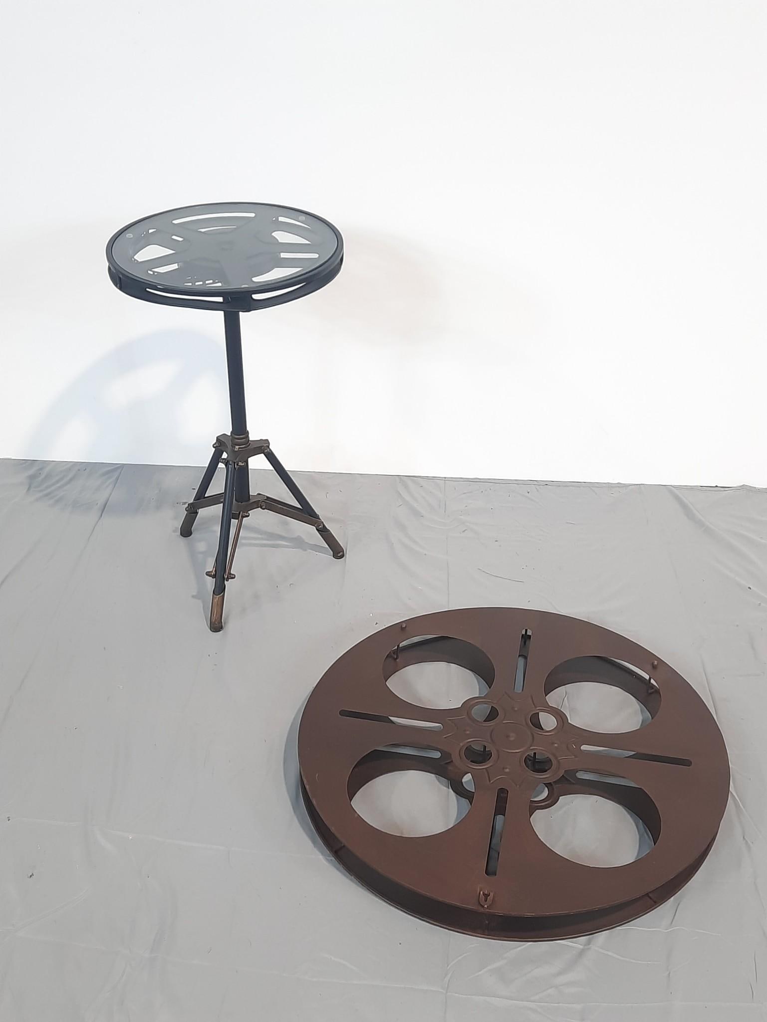 Film Reel Side Table and Wall Sculpture: NOT ELIGIBLE FOR IN-HOUSE SHIPPING. Table: 24-1/2" diameter x 14" high. Wall Sculpture: 24" diameter x 2-3/4" deep.