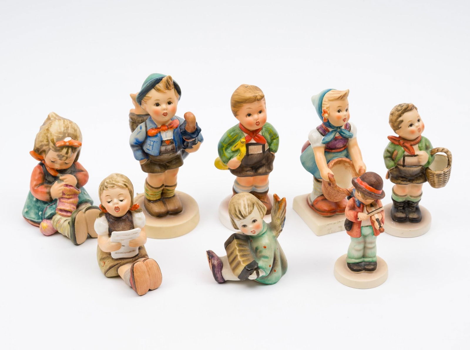 8 Hummel Figurines: 1-1/4" to 2" wide x 3" to 4-1/4" long.