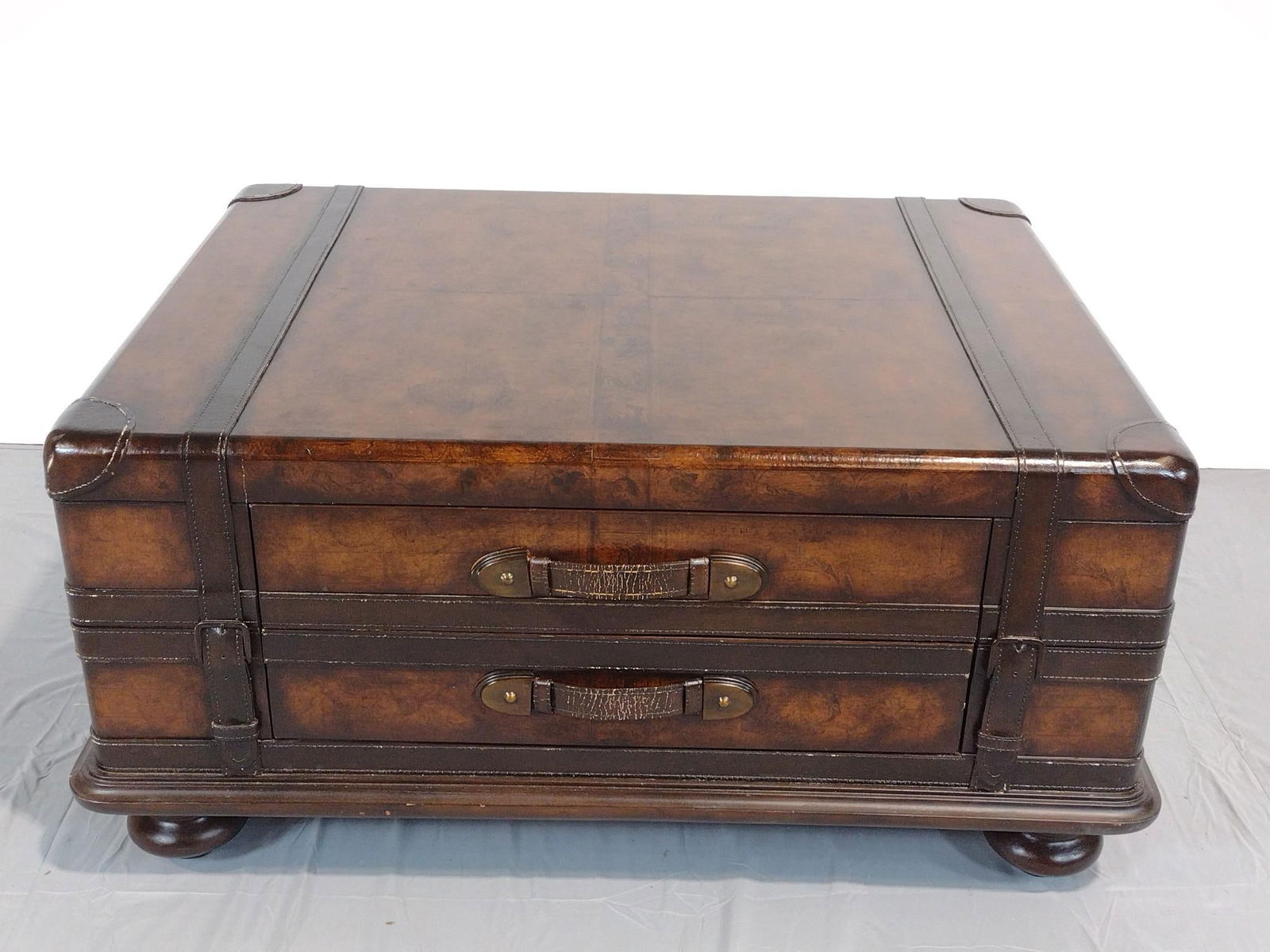 Four Drawer Luggage Coffee Table: NOT ELIGIBLE FOR IN-HOUSE SHIPPING. 43" wide X 33" deep X 20-1/2" high. Has some light scratches. No manufactures name found.