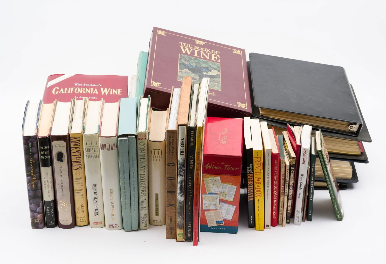 29 Wine & Oenology Books Incl The Book of Wine & Wine Advocate Guides: Includes topics on Thomas Jefferson, Corks, 19th century foodways, French regional wines, and more. Also includes a substantial amount of wine advocate guides. Condition: some warping due to moisture,