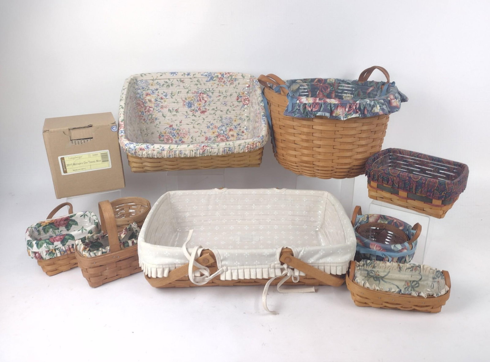 10 Longaberger Baskets & Longaberger Mug in OB: Baskets measure 4-3/4" to 13-3/4" wide x 4-1/4" to 8-1/2" high.
