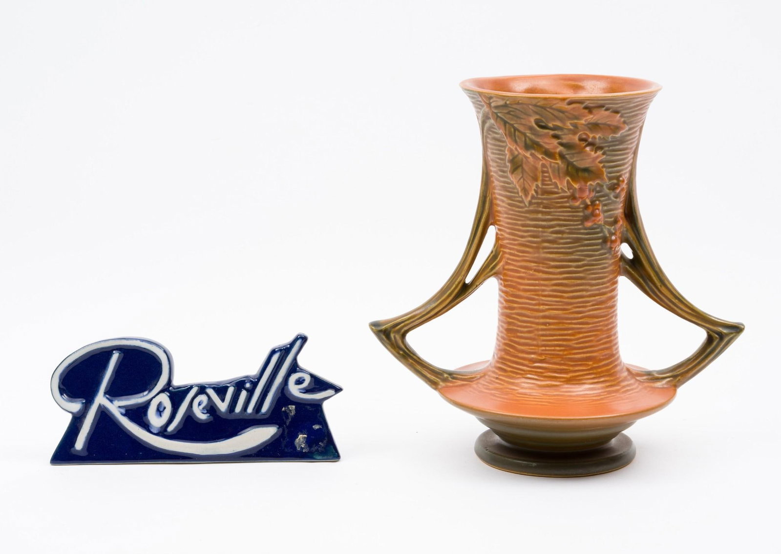 Rosevill Bushberry Vase w/ Roseville Sign: 6-1/4" to 8-1/2" wide x 2-3/4" to 8" high.
