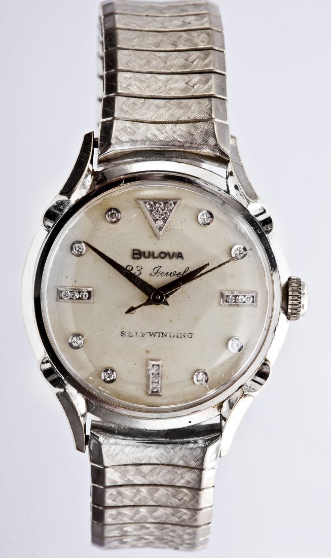 Bulova 23J 14K Diamond Dial Wristwatch: DESCRIPTION: Bulova 14K white gold wristwatch. Silvered dial marked "Bulova 23 Jewels Self Winding" and set with eight approximately 1-1/2 point and fifteen approximately 1 point round diamonds. Appro