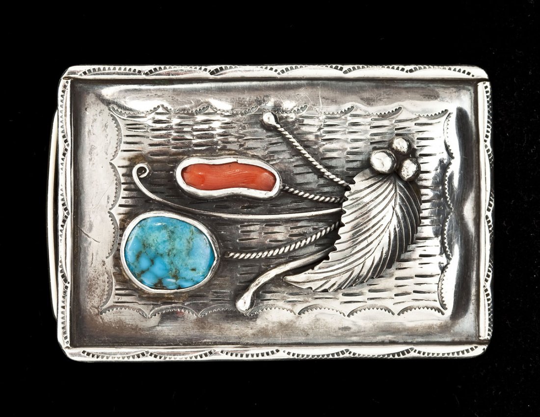 Navajo Silver & Stone Buckle: DESCRIPTION: Navajo silver buckle with turquoise and carnelian stones and an applied leaf design. 2" x 3".