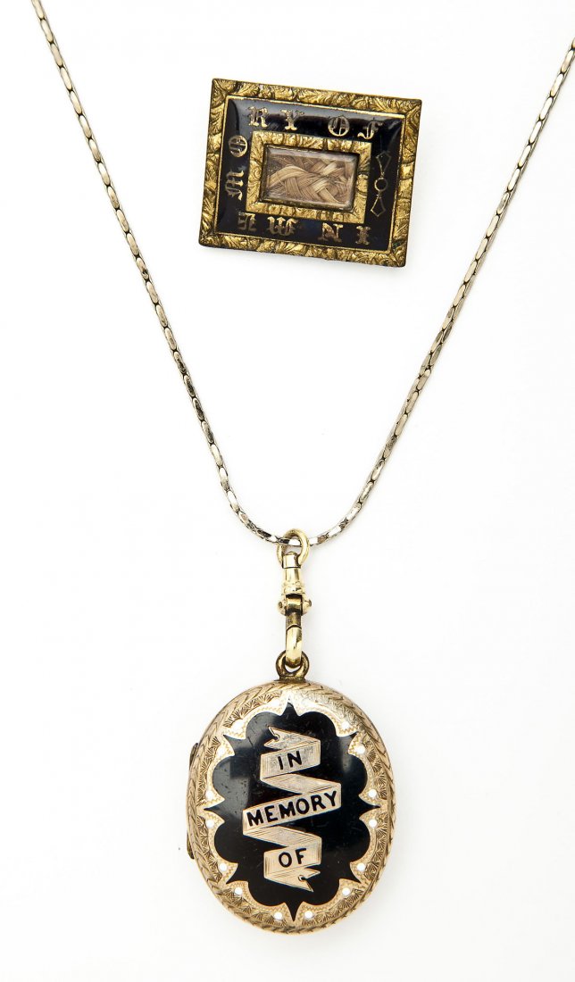 2 Pcs In Memory Of Mourning Jewelry: DESCRIPTION: Two pieces of mourning jewelry including: 1) Goldfilled locket with black and white enameling reading "In Memory Of" to front with scrolled engraving verso. On modern goldfilled chain. 1-
