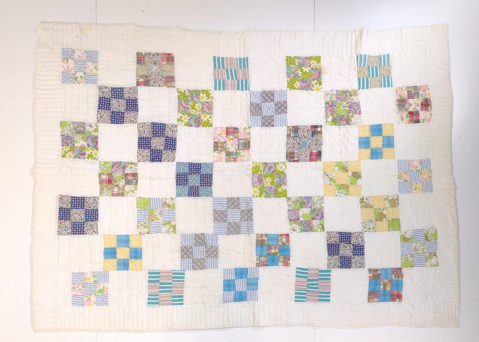 Vintage Patchwork Quilt: 5'9" wide X 7'11" long. Has some spots of discoloring.