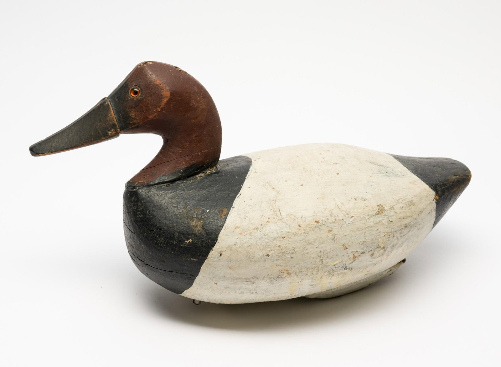 Antique Wooden Duck Decoy: 7-1/4" wide x 7-1/4" high. Some paint loss and cracks in wood.