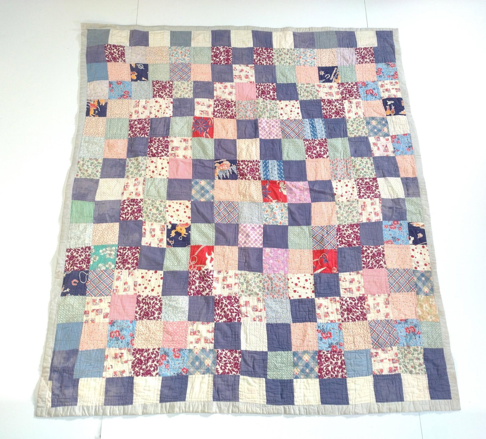 Vintage Patchwork Quilt: 5'4" wide X 6'4" long. Some wear consistent with age and use.