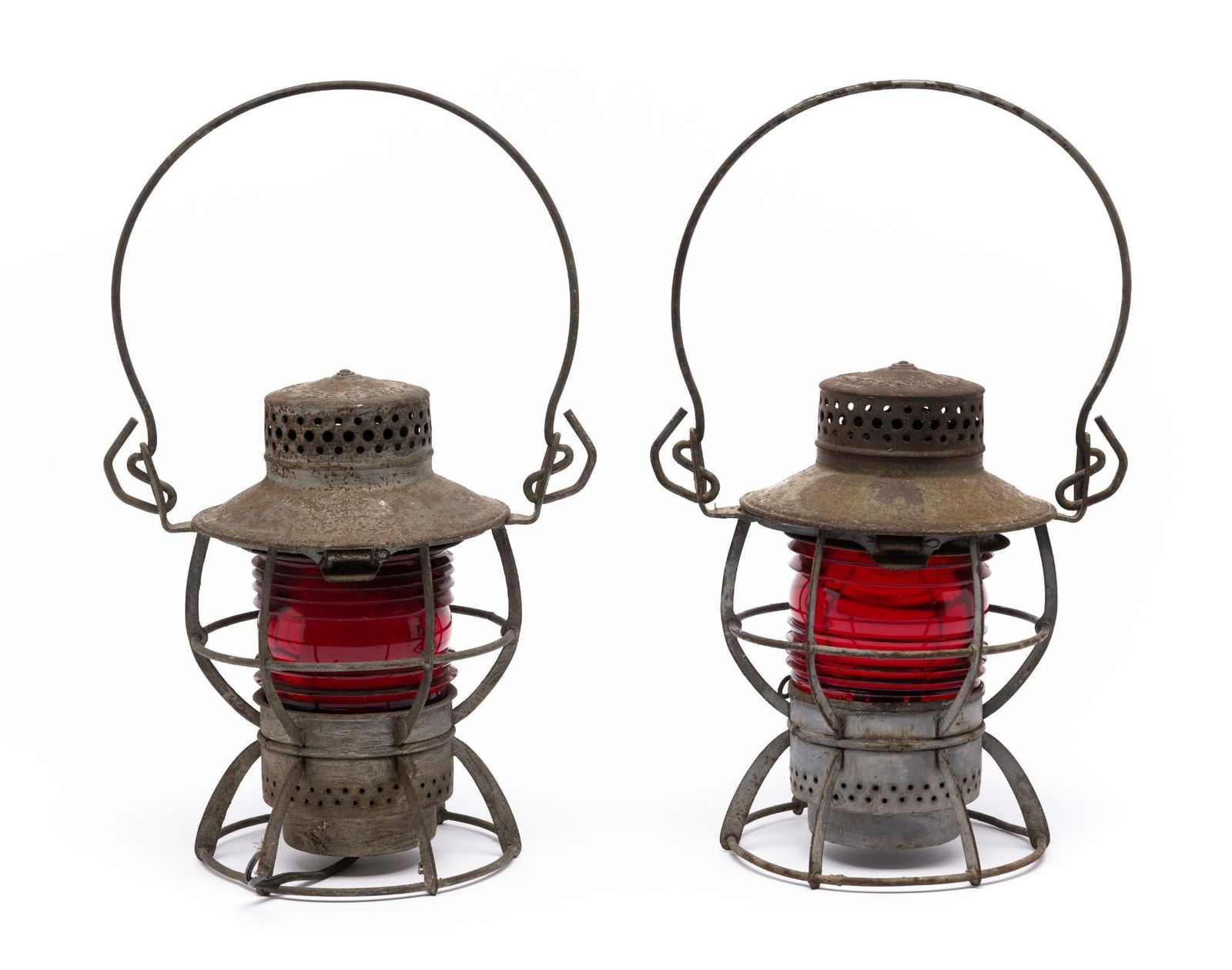 2 Dressel Arlington Lanterns incl PRR: Both approx 14" from base to top of handle extended. One lantern is wired with cut wires. Rust consistent with age.