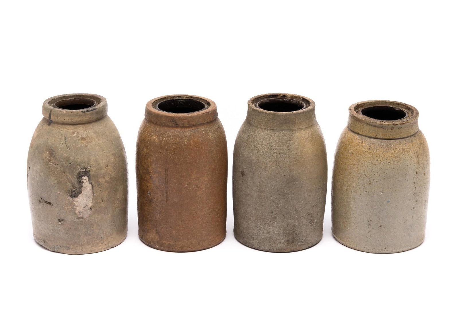 4 Stoneware Jars: 7-1/2" to 8-1/2" tall overall. All with chips and wear associated with age and use.