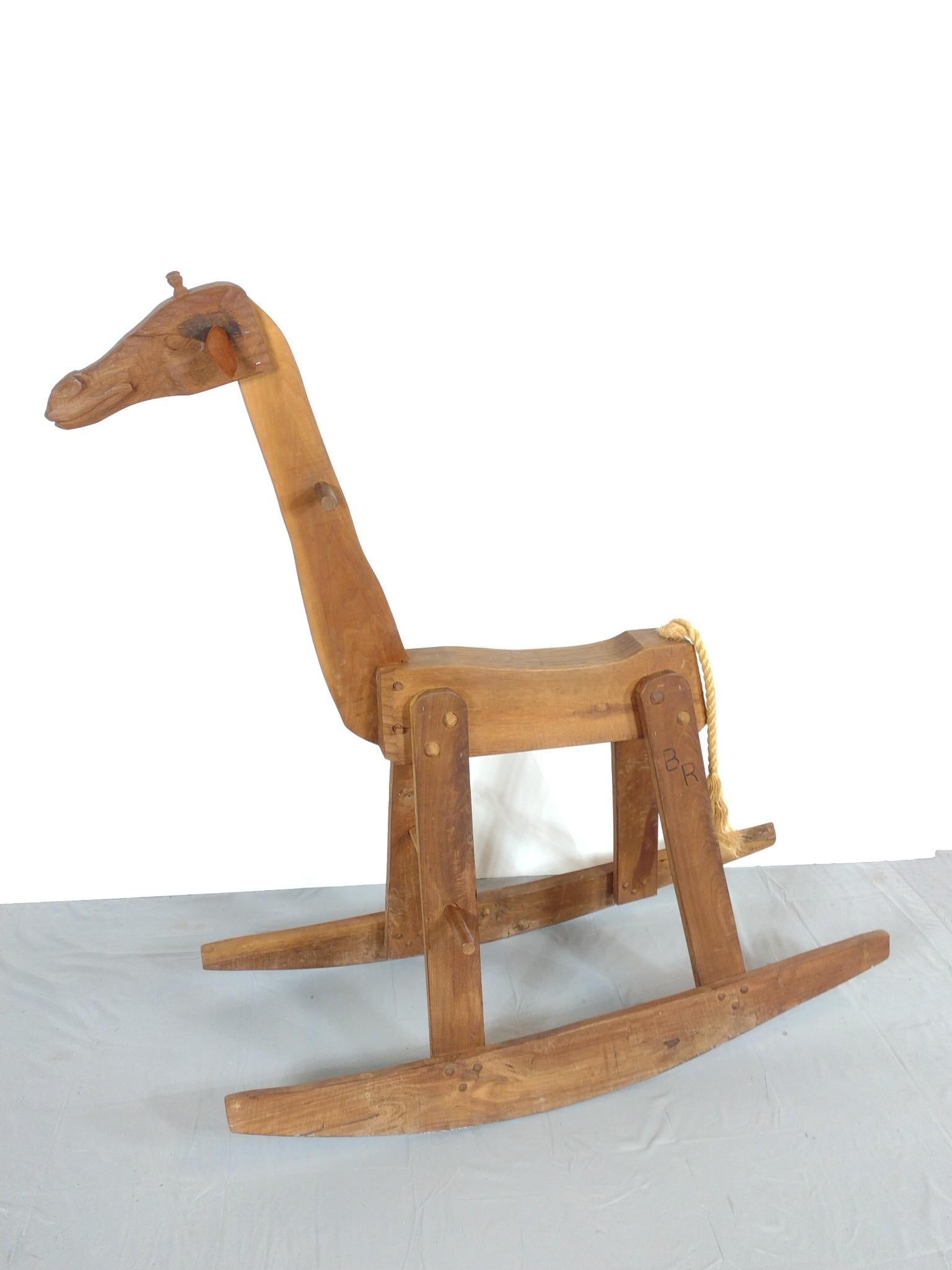 Carved Wood Giraffe Rocker: NOT ELIGIBLE FOR IN-HOUSE SHIPPING. 18" wide X 45" deep X 50-1/2. Stamped BR. ?????
