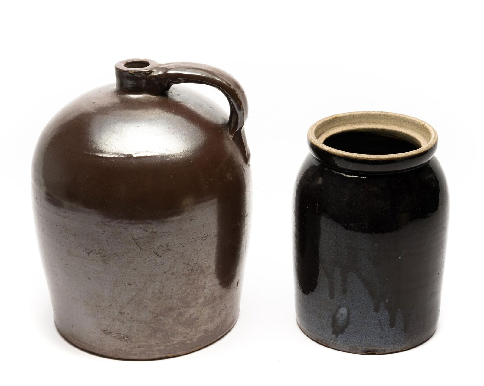 Two Stoneware Crocks: 6" to 7-1/4" wide x 9" to 12-1/4" high.