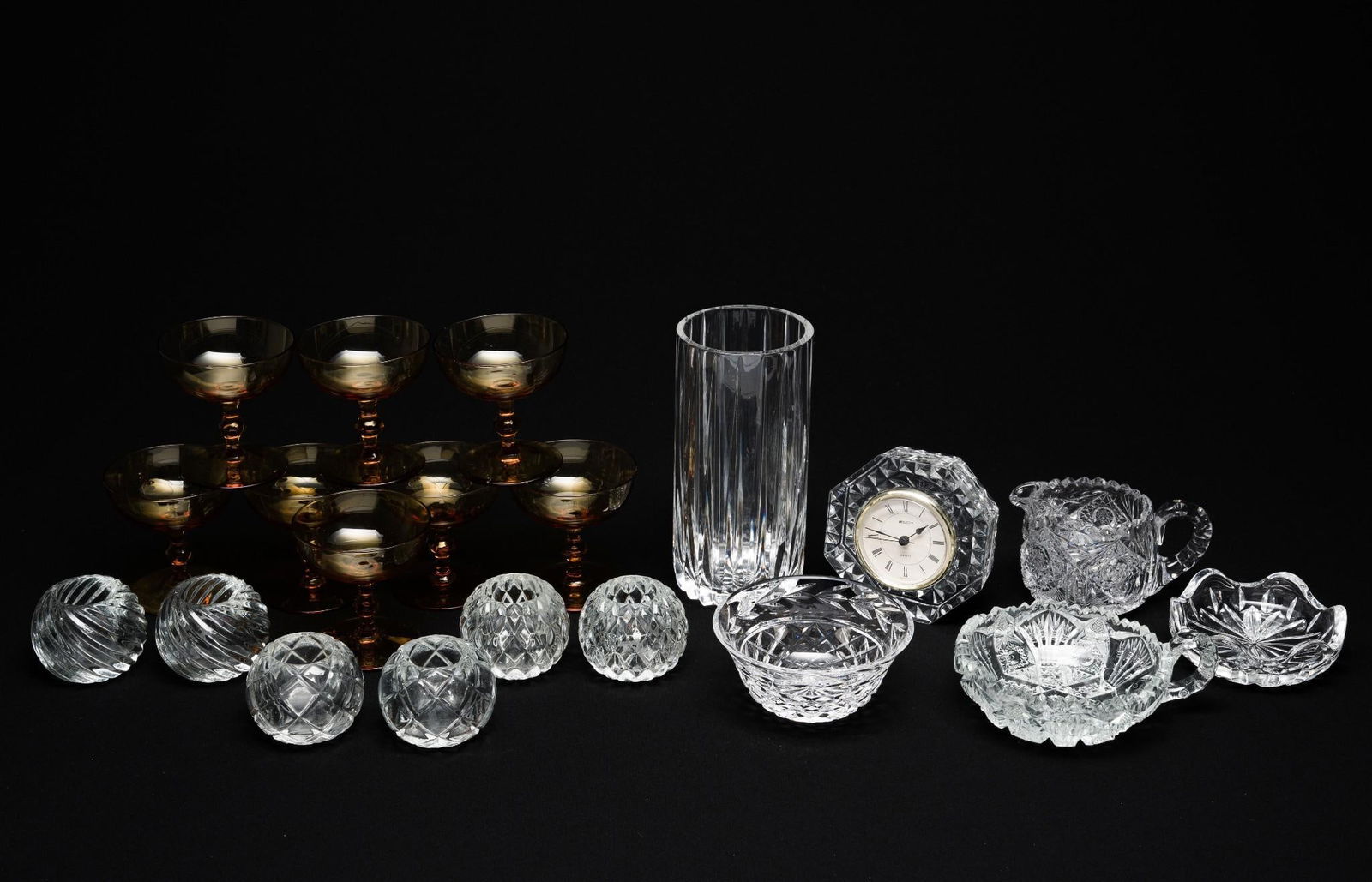 20 Pieces of Glass Incl. Cut: Includes 8 pieces of amber cocktail glasses, 6 glass candle votives, and 6 various cut and press glass pieces. Glasses are 4" tall. Votives are ~2-1/2" tall. Misc pieces are 2" to 8" tall overall x 3"