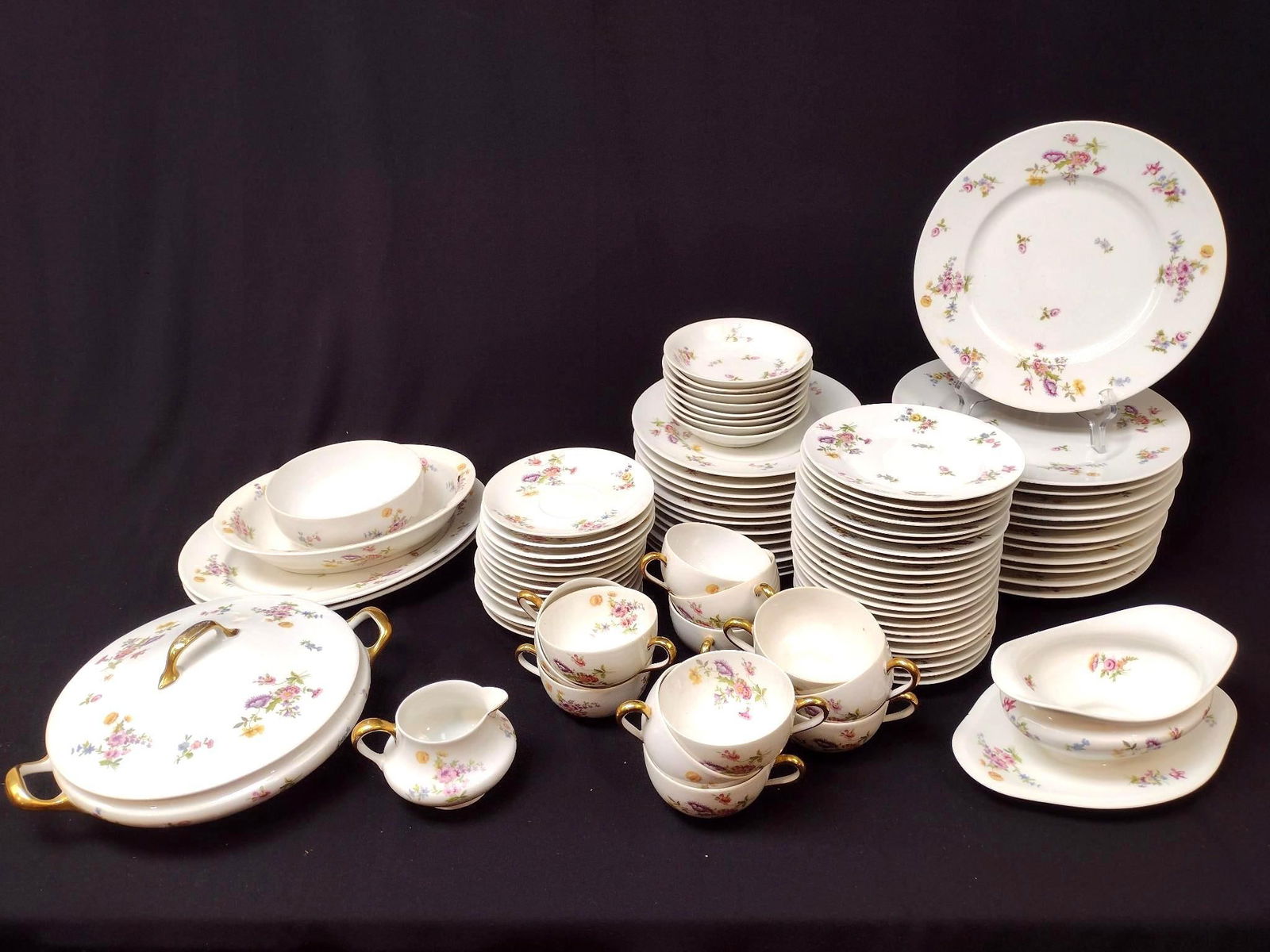 86 Pieces of L. Bernardaud & Co. Limoges China "BERB3": Floral Sprays on White Pattern. Largest plate is 9-1/2" diameter. Some minor chips on some pieces, but overall good condition.