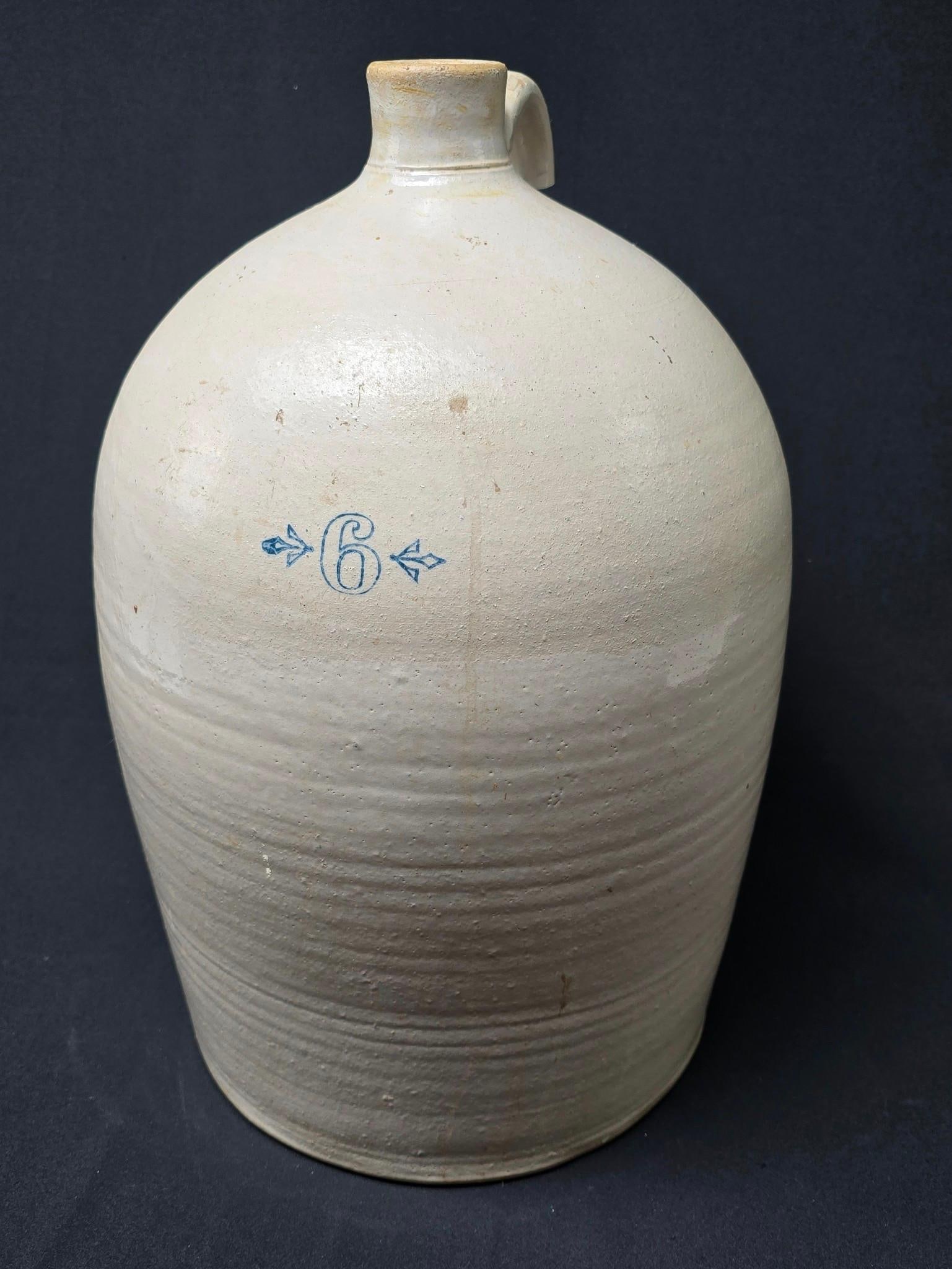 Unmarked 6 Gallon Stoneware Jug: Circa 19th century. Unmarked. No decoration. 10-1/2" wide x 18" high. Handle broken.