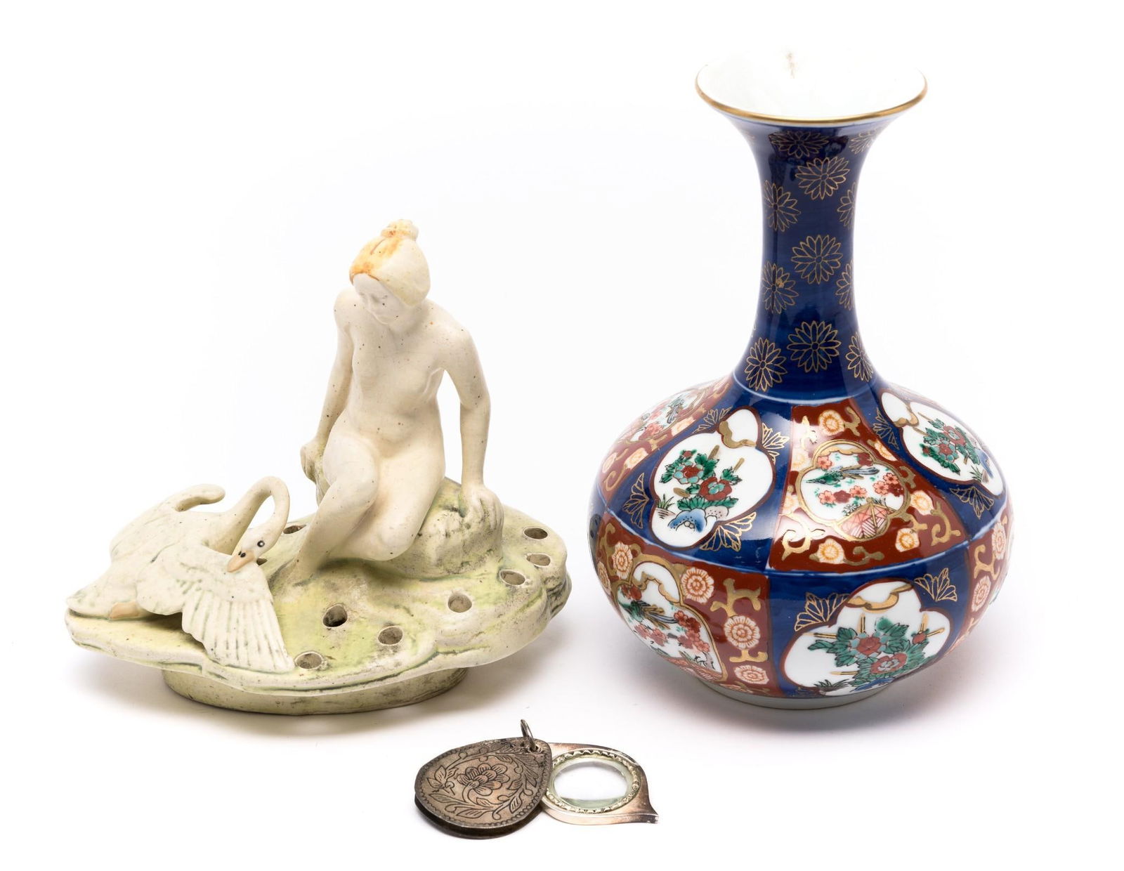 Vase, Figurine, and Magnifying Glass: 5-1/2" to 7" wide x 6" to 8" high.