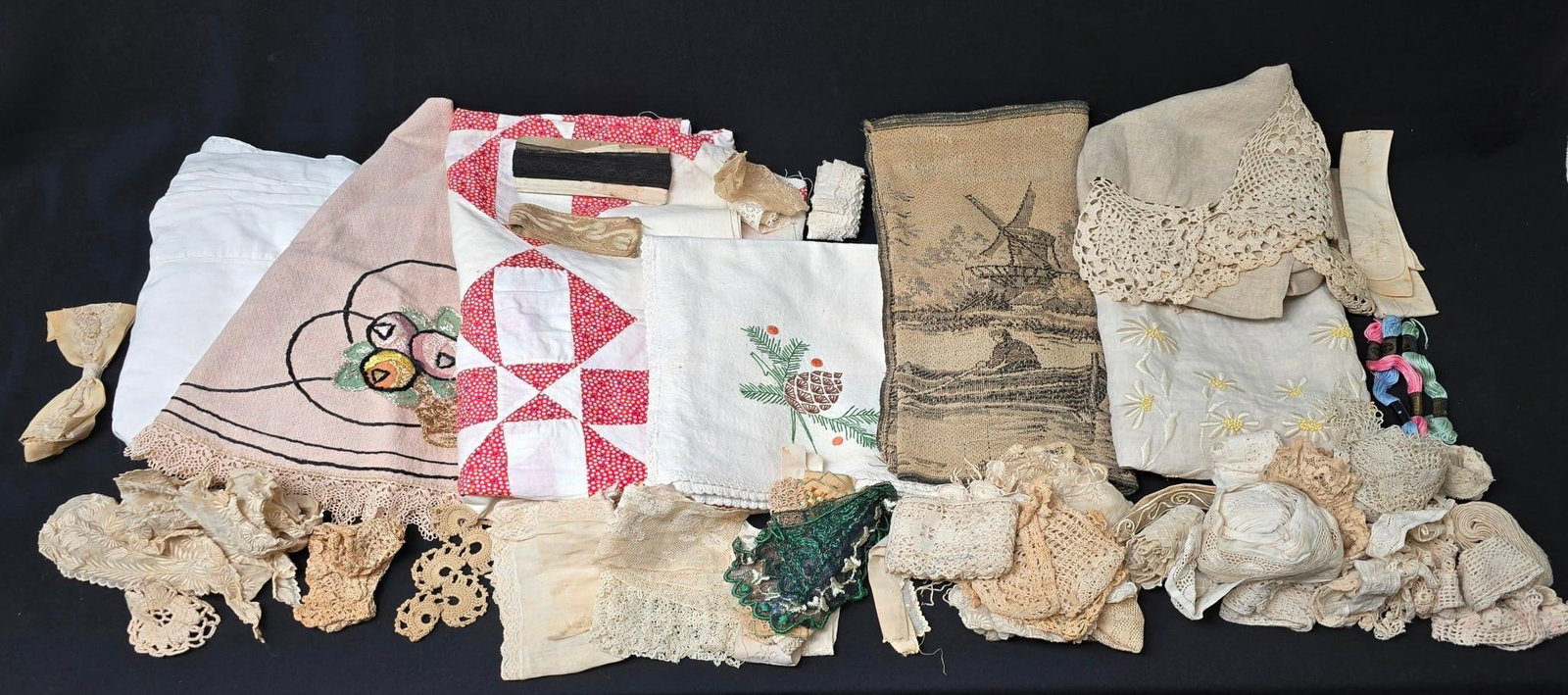 Large Lot of Antique and Vintage Linens, Lace, and Doilies: Includes quilt pieces, lace pieces, and more. Overall good condition with normal wear and tear. Dollies are made of paper - some losses.
