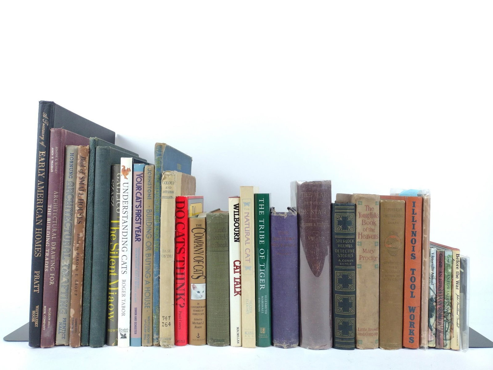 36 Books & Ephemera Incl Interior Decorating: Includes various topics on cats, interior decorating, art history, and more. All in good condition with normal wear and tear.