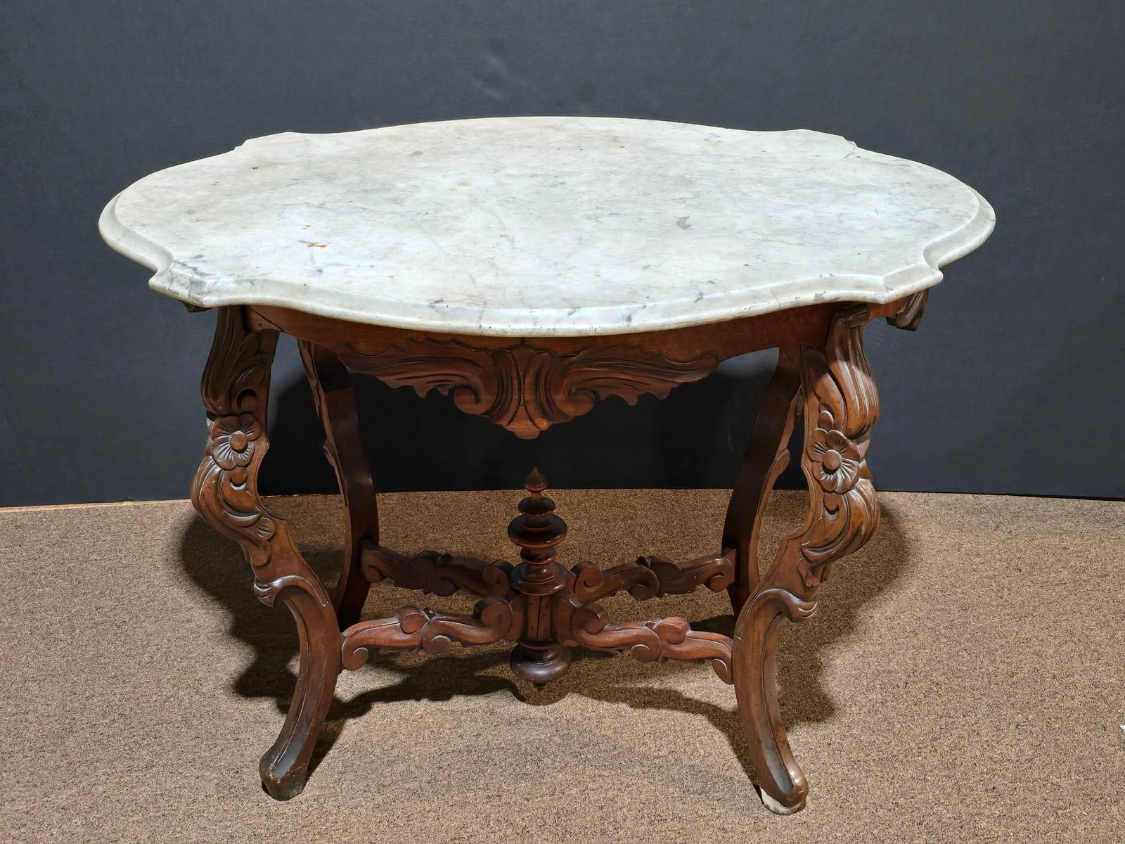 Marble Top Parlor Table: NOT ELIGIBLE FOR IN-HOUSE SHIPPING. 27" wide x 39" long x 28" high. Crack in two legs. Crack at base. Small piece missing under marble top.