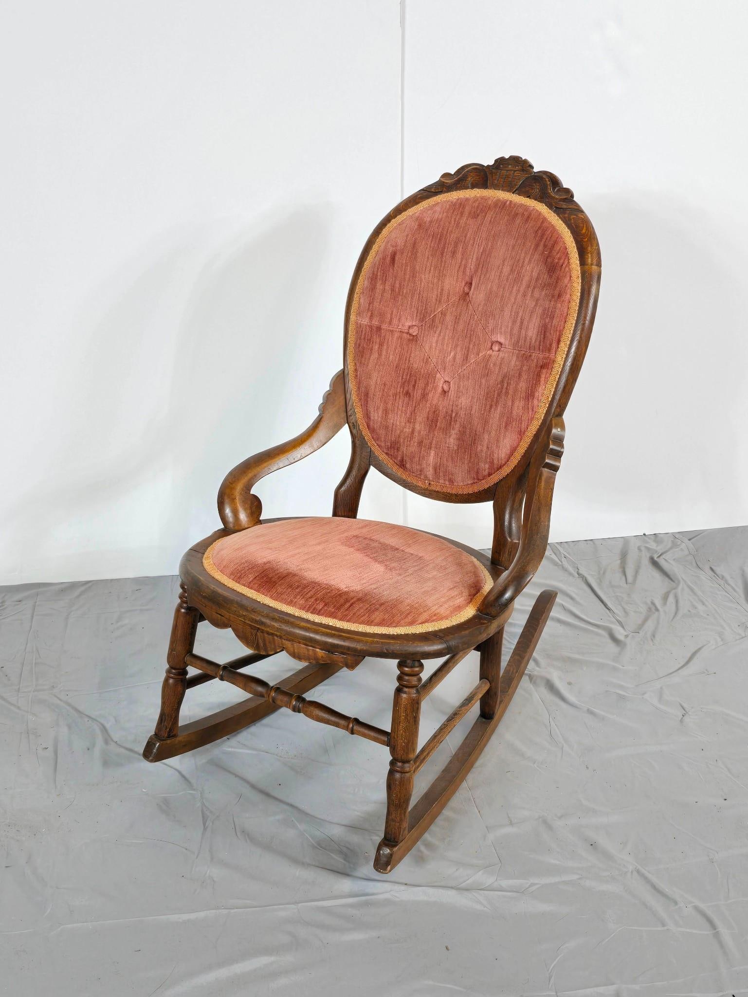 Vintage Upholstered Rocking Chair: NOT ELIGIBLE FOR IN-HOUSE SHIPPING. With pink velvet upholstery 21-1/4" wide x 30" deep x 33-1/2" high. Some fading to the upholstery.