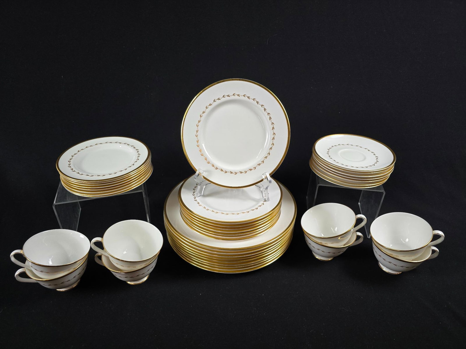 40 Pieces of Royal Doulton "Covington" China: Gold-rimmed china service. Chip to rims of a few plates, but overall good condition.