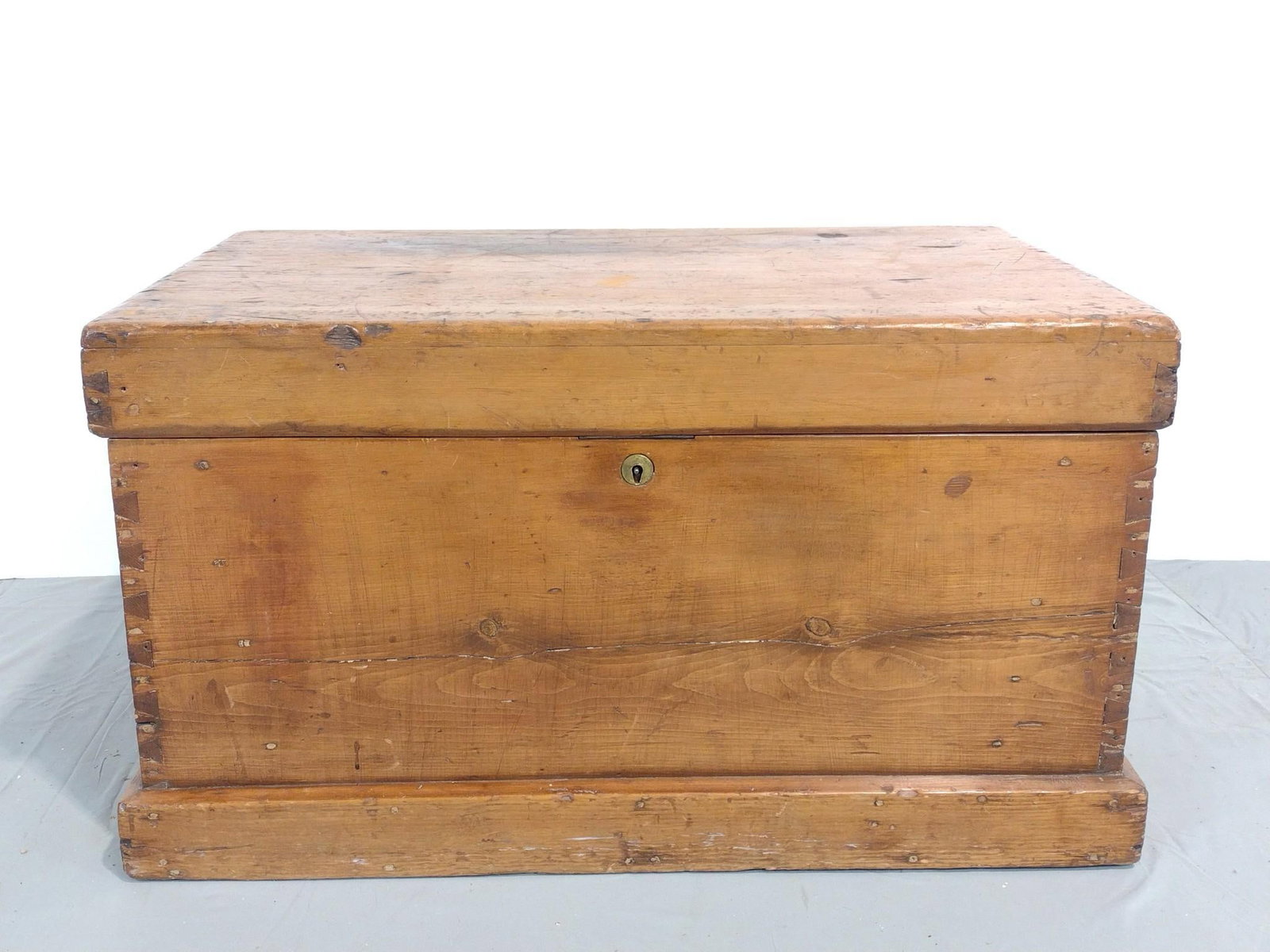 Antique Dovetail Trunk: NOT ELIGIBLE FOR IN-HOUSE SHIPPING. 36" wide X 22" deep X 20" high. Has wear consistent with age. Unable to open, will need key.
