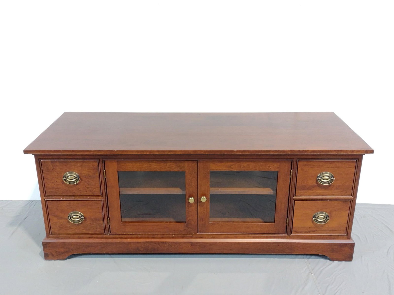 Chatham Entertainment Stand: NOT ELIGIBLE FOR IN-HOUSE SHIPPING. 62-3/4" wide X 24" deep X 24-1/2" high. Has some light scratches.