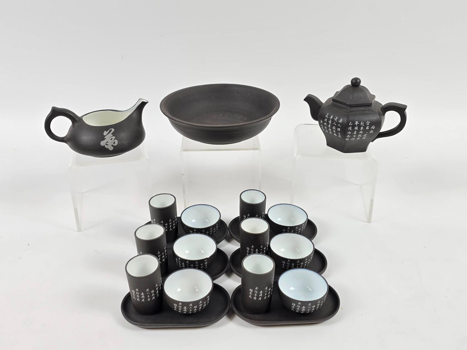 21 Pc Japanese Tea Service: Cups measure 1-1/2" to 2" wide x 1-1/4" to 2" high. One cup with chip to rim.