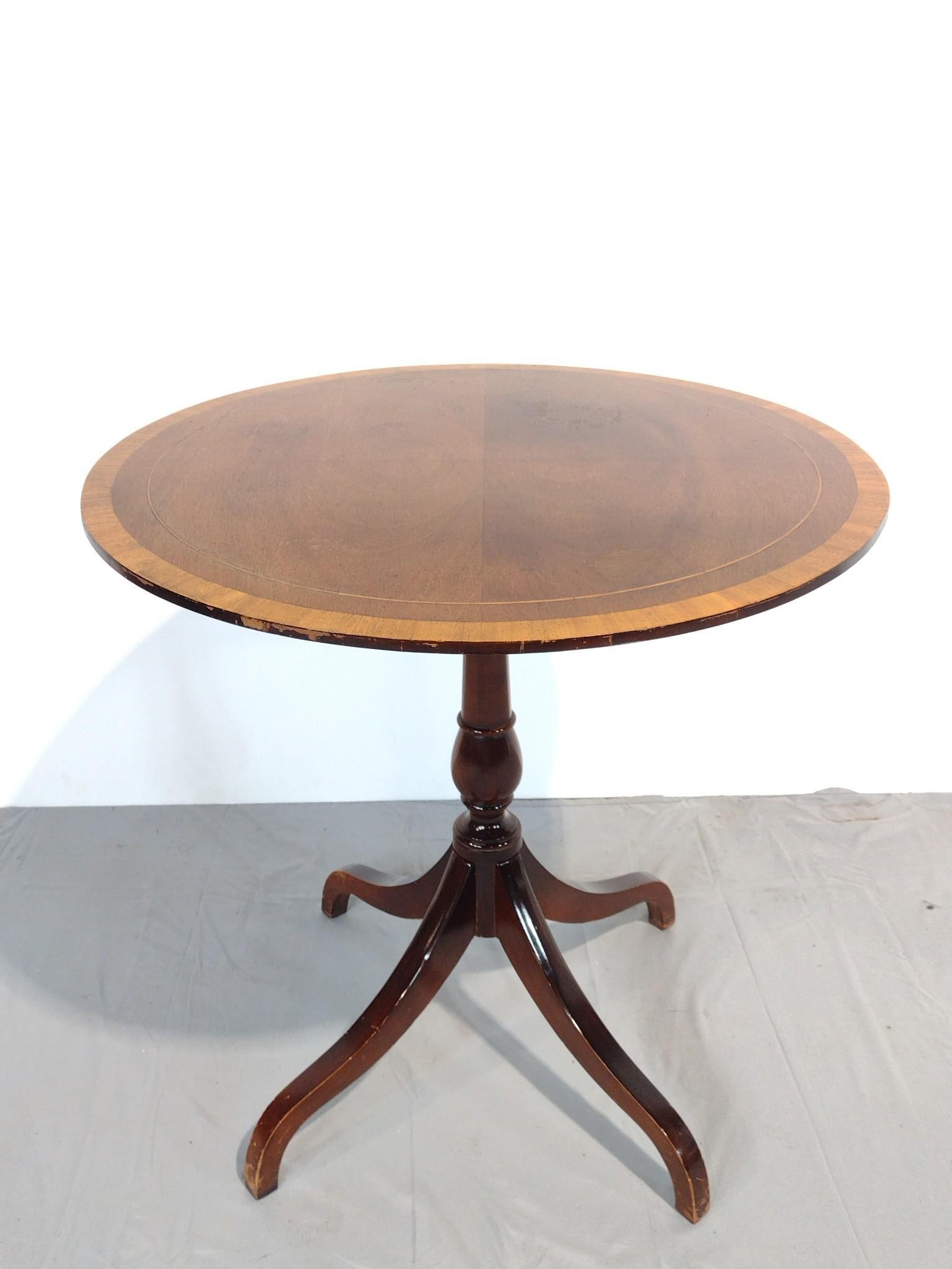 Tilt Top Table: NOT ELIGIBLE FOR IN-HOUSE SHIPPING. 26" diameter X 26" high. Has some scratches and finish loss.