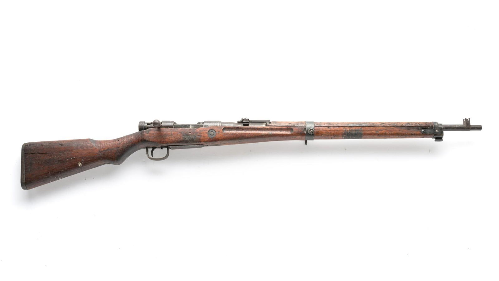 Japanese Type 99 Bolt Action Battle Rifle, Caliber 7.7 Jap: Serial Number: 24690 Design: This WWII Japanese Type 99 bolt action battle rifle has a 26" barrel and the number on the bolt matches that found on the receiver. This piece shows battle use and wear ov