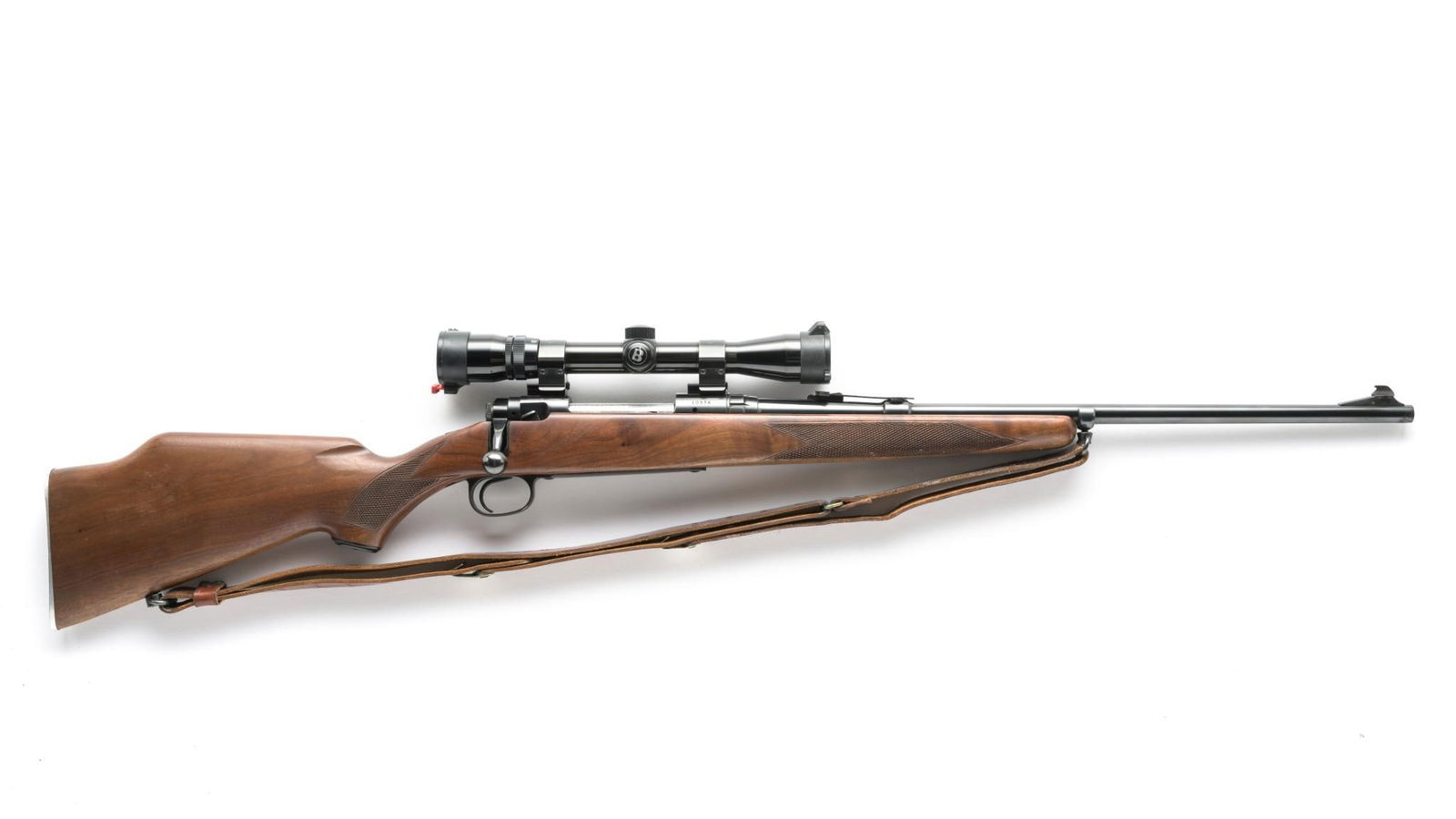 Savage Model 110 Bolt Rifle w/ Scope, Caliber .308 Win.: Serial Number: 10974 Design: This Savage Model 110 bolt action rifle has a 22" barrel and is chambered for the .308 Winchester cartridge. Satin finished checkered stock is in solid shape showing only