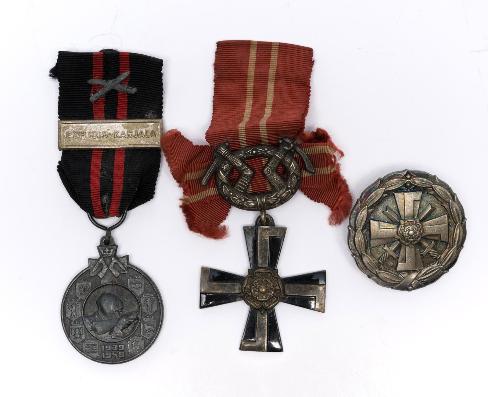 3 Finnish WWII Medals: DESCRIPTION: Includes (1) Liberty Cross 1941; (2) Winter War 1939-1940 Medal; and (3) Badge for Disabled Military Veterans. MEASUREMENT: 1-1/4" to 1-1/2" wide x 1-1/2" to 3-3/4" long.