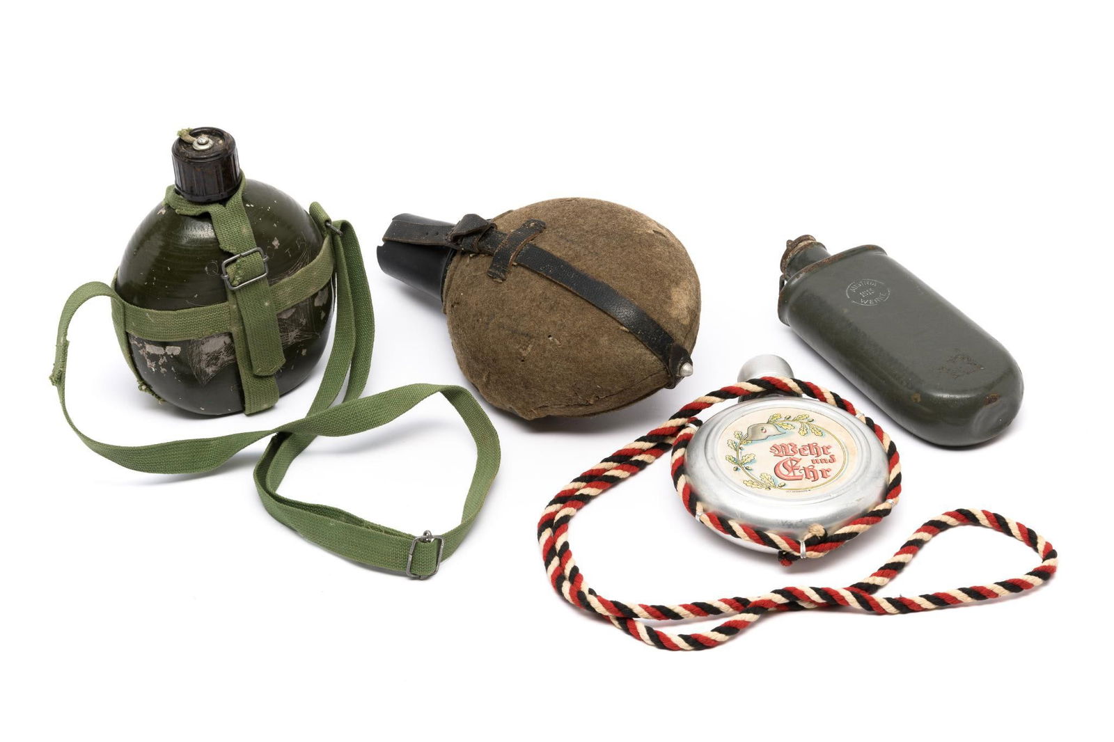 WWI And WWII Flask Canteen Lot: DESCRIPTION: Four canteens or flasks including WWI German Regimental Soldier Flask. WWII German Army Tropical Canteen.