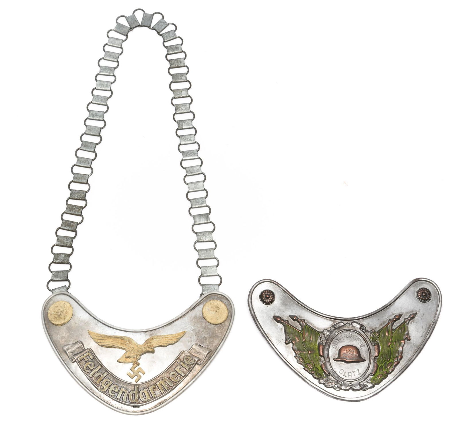 Two Military German Police Gorget: DESCRIPTION: One with necklace chain stamped FI. U.V. 1935 and with symbol on the longer aluminum fold-over clip on the back. MEASUREMENT: Both approximately 6 1/2" width.