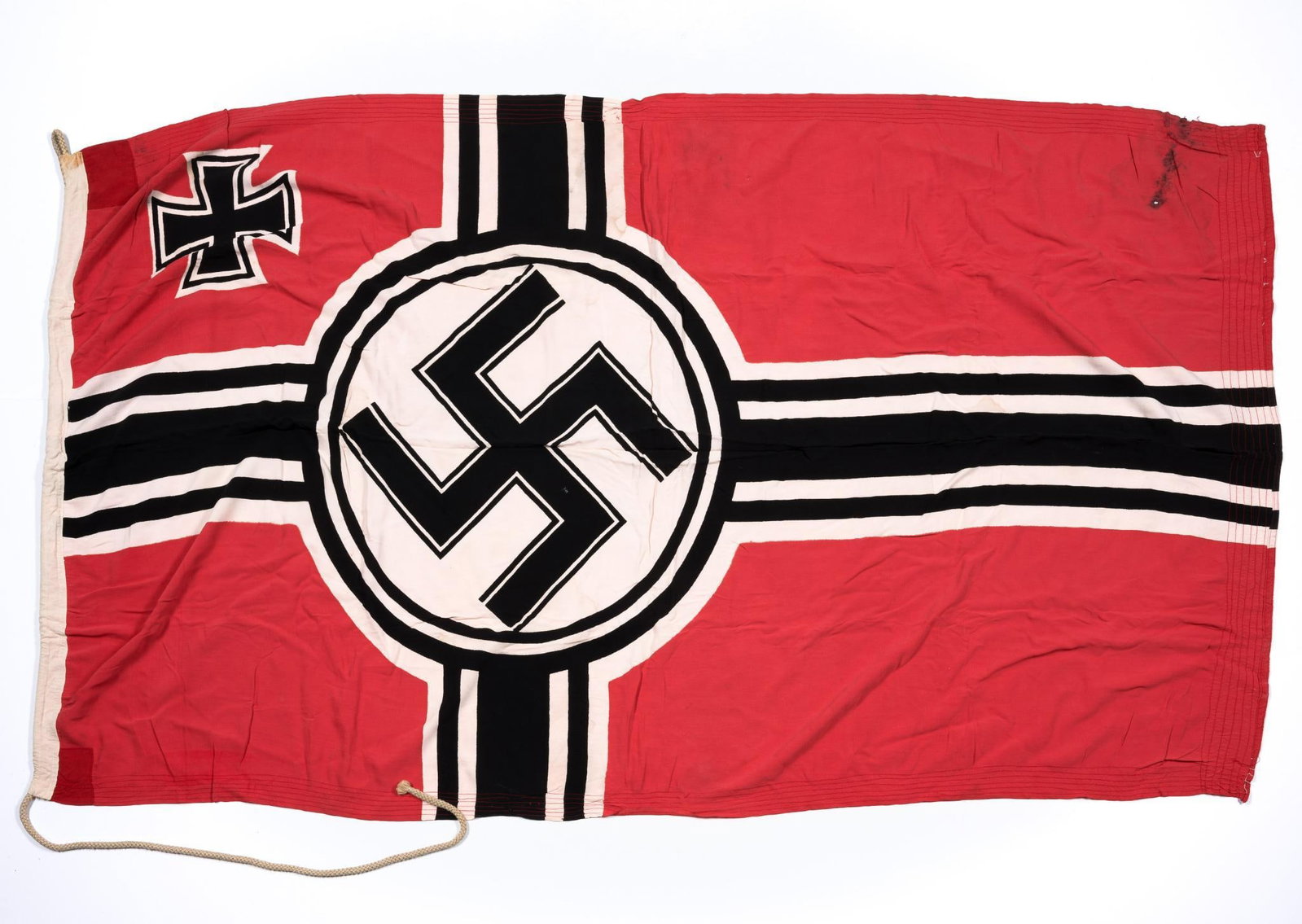 German WWII Kriegsmarine Battle Flag: 48" X 86". Area of burns noted at one corner and other signs of aging.