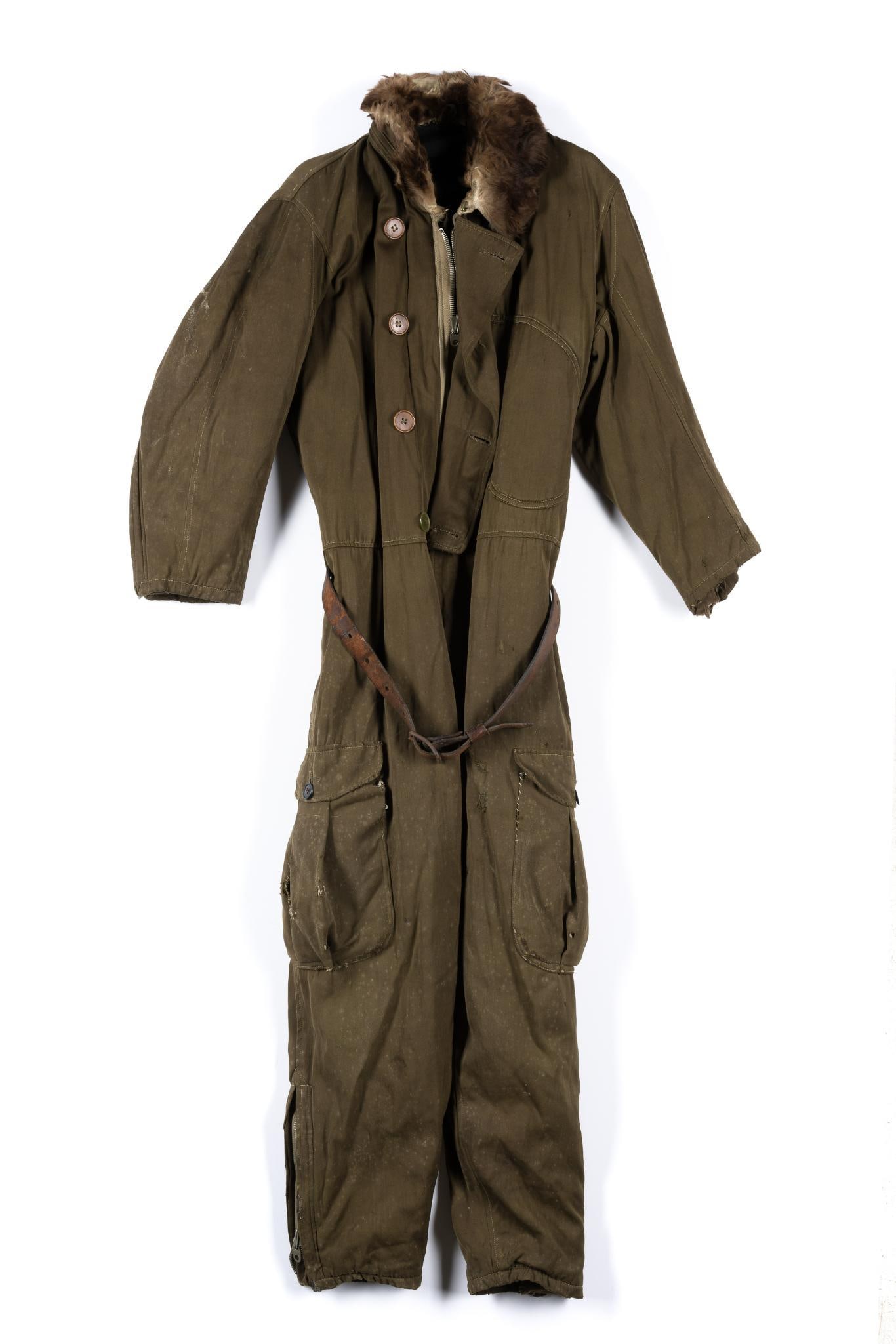 World War II Japanese Flight Suit w/ Fur Collar: DESCRIPTION: Cold weather flight suit with original leather belt. CONDITION: In good condition with numerous repairs from time of use including sewn patches. Missing one fly button. MEASUREMENTS: Medi