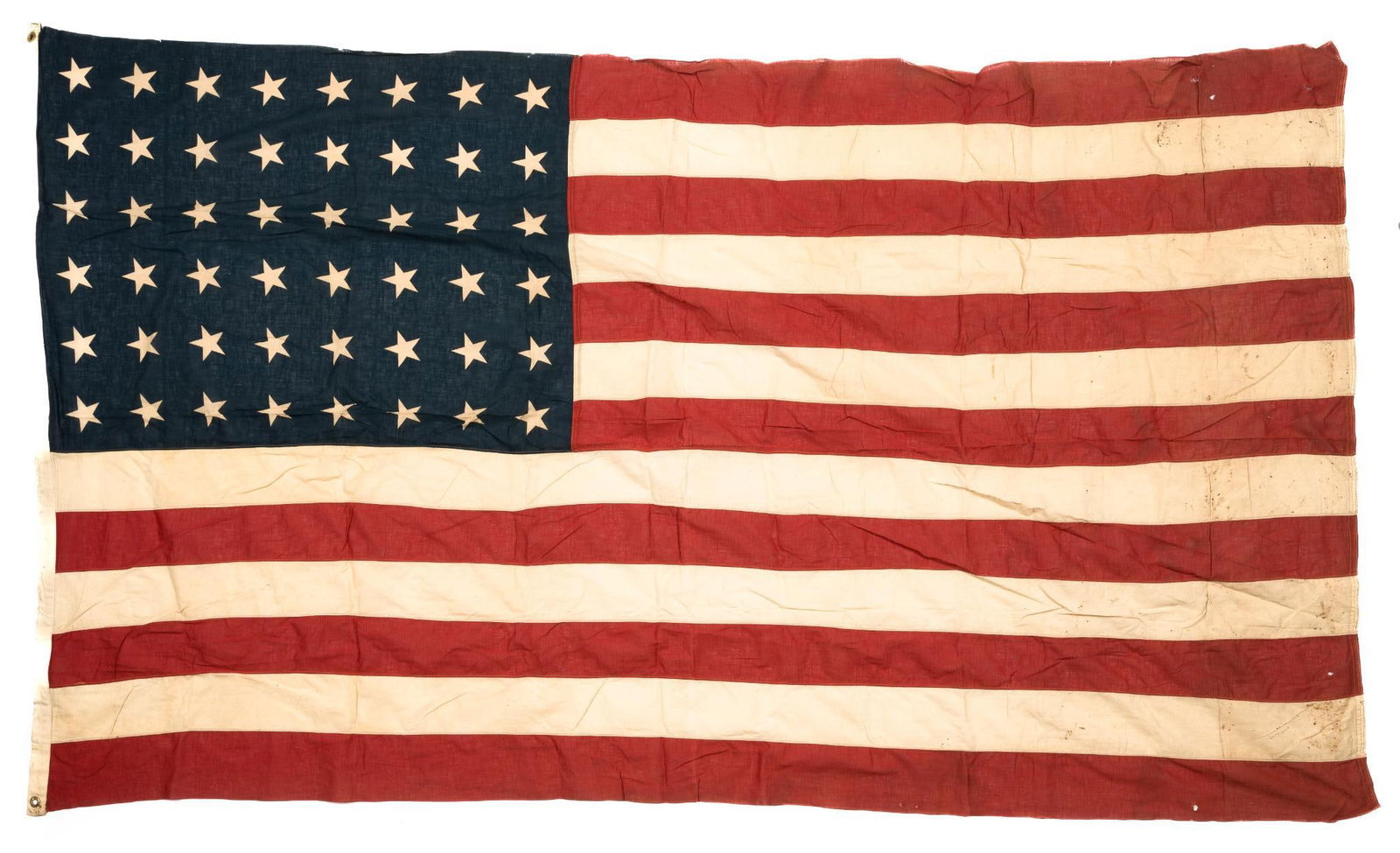Large 48 Star American Flag: DESCRIPTION: Early American flag with 48 stars. The 48 star flag was the result of New Mexico and Arizona becoming states in 1912. In 1959, President Eisenhower changed the arrangement of the stars to
