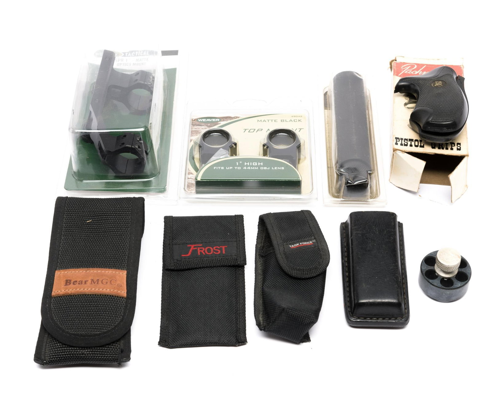 9 Gun Accessories: DESCRIPTION: Includes (4) magazine pouches; Pachmayr pistol grip, in OB; (2) top mounts; AR-15 reverse thread slip; and revolver speedloader. CONDITION: Most in original boxes.