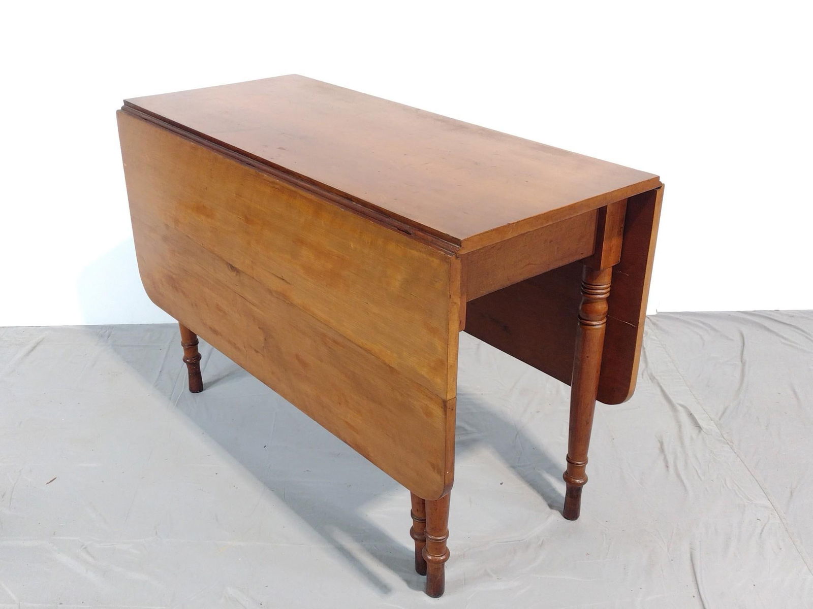 Drop Leaf Table: NOT ELIGIBLE FOR IN-HOUSE SHIPPING. Open 54-1/2", closed 18-1/4" wide X 44" deep X 29-1/2" high. Has some scratches.