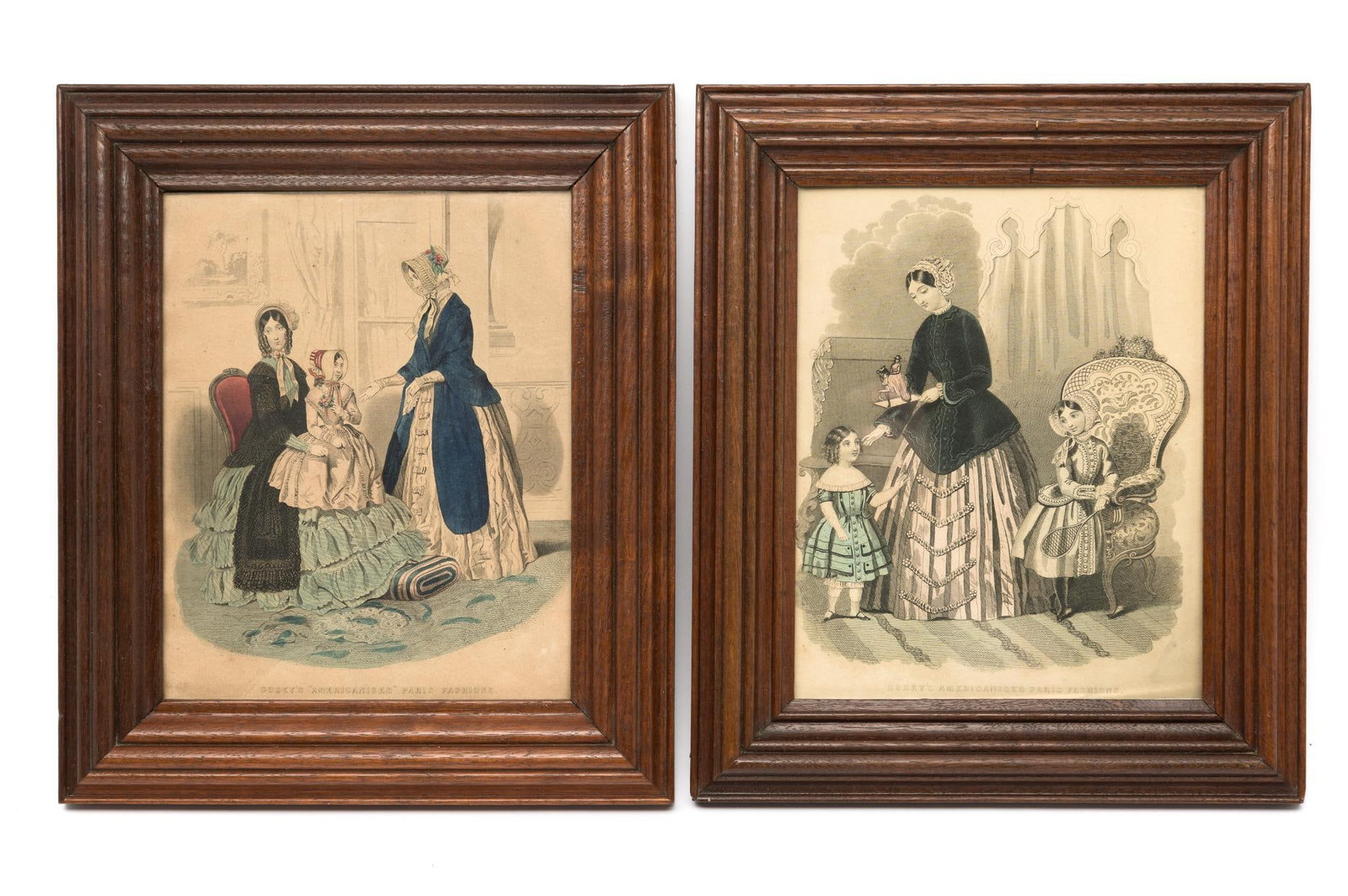 2 Godey's Colored Fashion Prints: NOT ELIGIBLE FOR IN-HOUSE SHIPPING. Sight each: 7-3/4" high x 6-1/4" wide. Overall with frames each: 11" high x 9-1/4" wide.