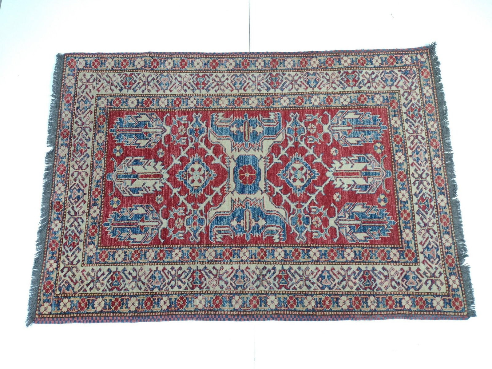 Oriental Area Rug: NOT ELIGIBLE FOR IN-HOUSE SHIPPING. 5'8" long X 4' wide. No manufactures name found. Has pet odor.