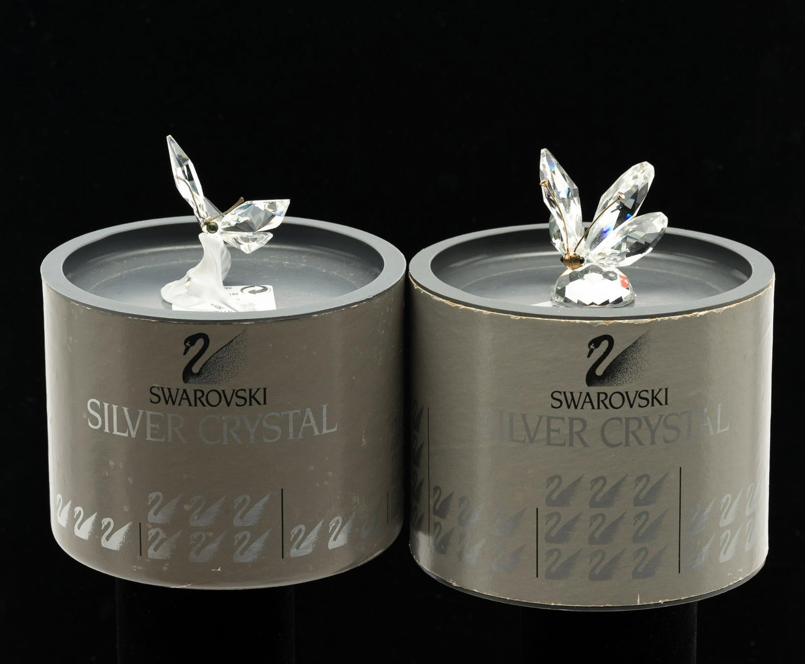 2 Swarovski Crystal Butterflies in OB: Boxes measure 5" wide x 3-3/4" 4" high. Also includes pouch of loose Swarovski crystals.