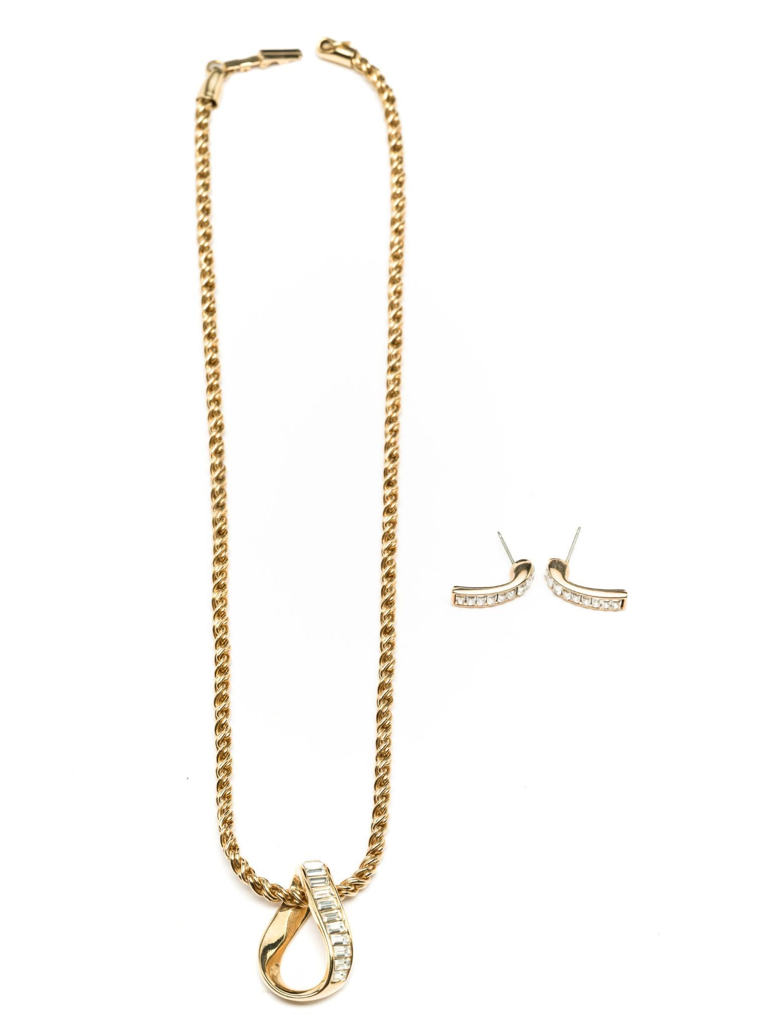 Swarovski Necklace & Earring Set: Swarovski crystal pendant necklace and earrings. Necklace measures 18" long. Earrings measure 1/4" wide x 3/4" long.